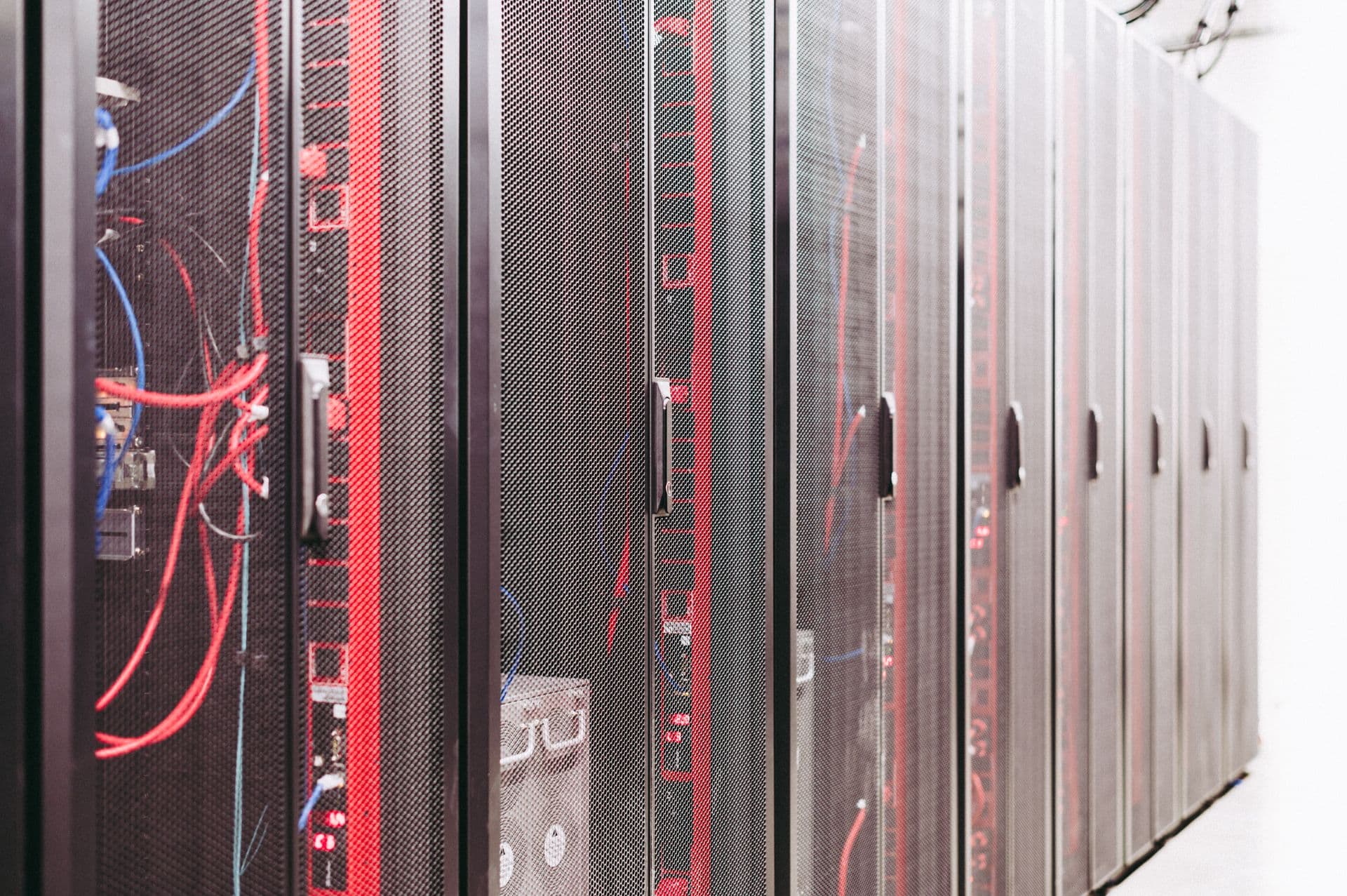 Server cabinets and network cabling inside a data center.