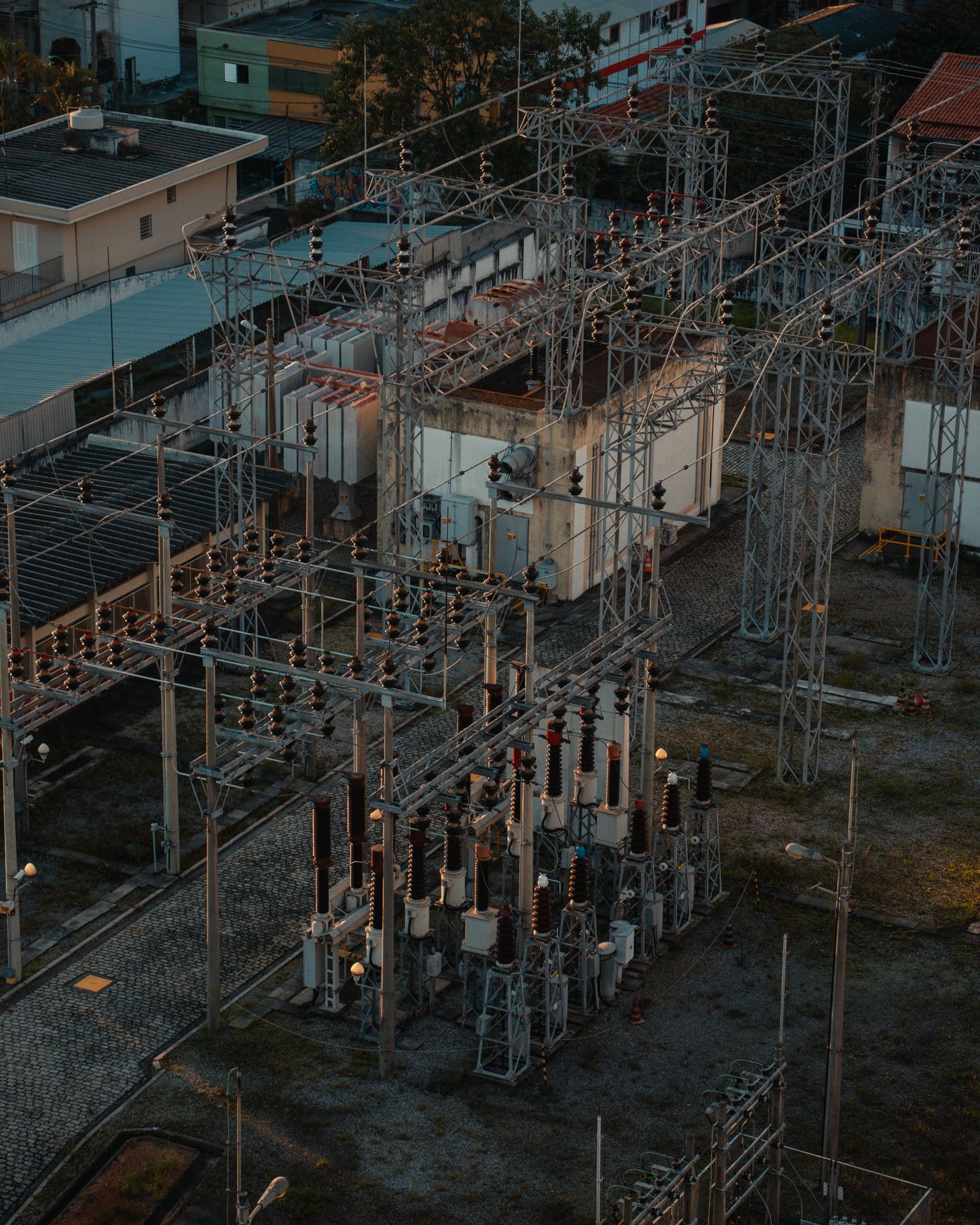 Bus structures and insulators across an electrical substation.