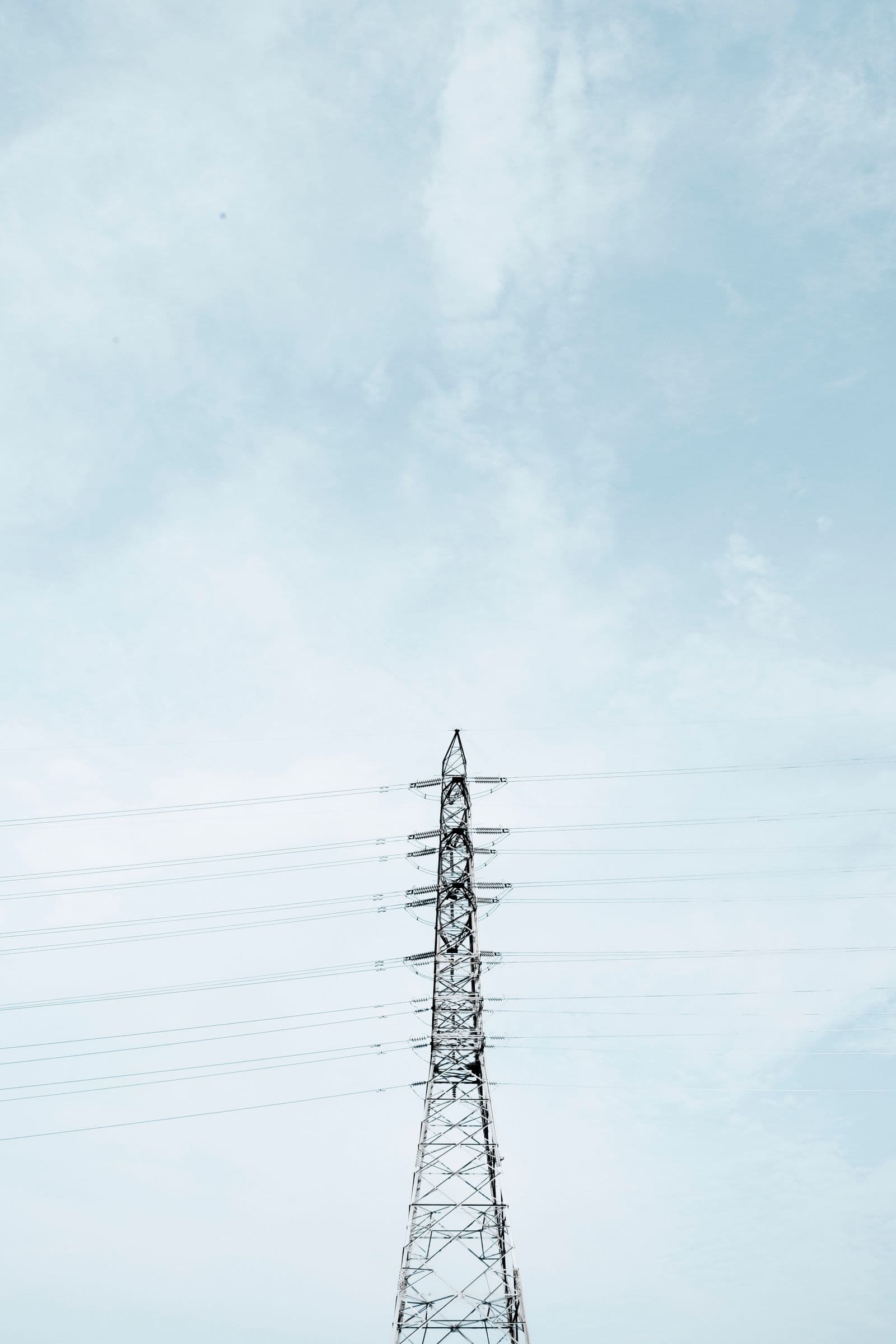 Transmission towers carrying power lines toward the horizon.